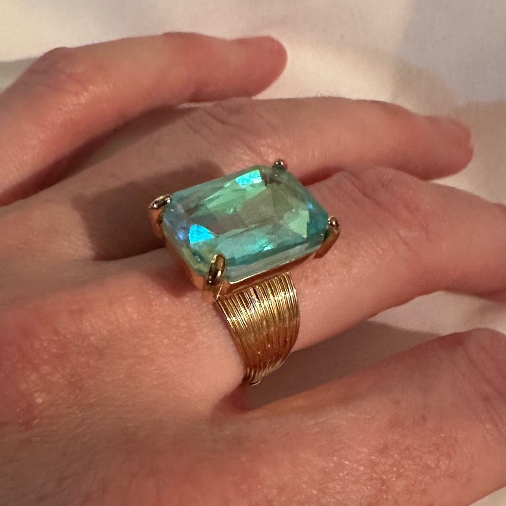 Giant lab created Topaz ring with gold tone adjustable band